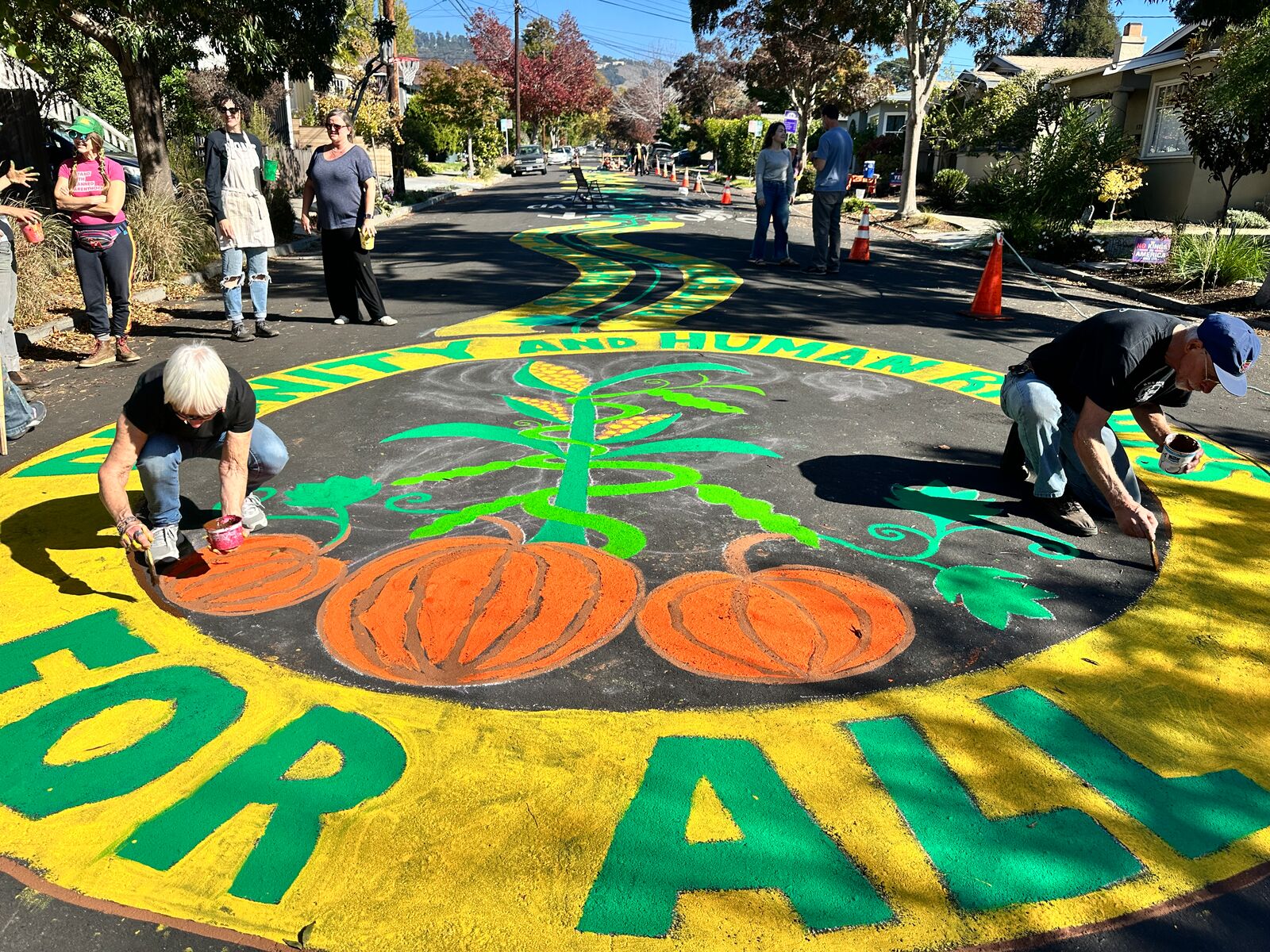 Neighbors paint street mural on Halloween to celebrate community